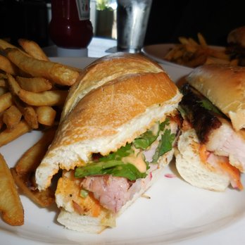 Yard House - Pork Banh Mi with thick, fatty slice of pork belly, refreshing cilantro, spicy creamy aioli, and tart pickled radishes - New American Near Me - Concord, California