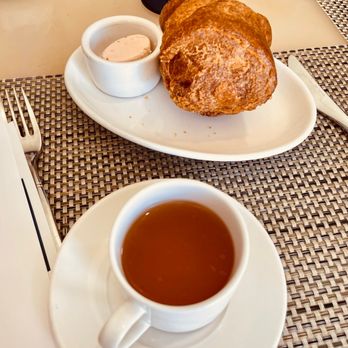 Mariposa - a cup of tea and croissants on a table - New American Near Me - Boca Raton, Florida Mariposa - a cup of tea and croissants on a table - New American Near Me - Boca Raton, Florida