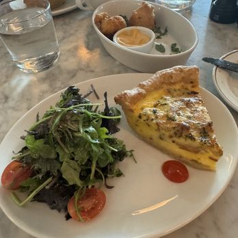 Kimpton Hotel Fontenot - Quiche Lorraine, salad and crawfish beignets - Hotels Near Me - New Orleans, Louisiana Kimpton Hotel Fontenot - Quiche Lorraine, salad and crawfish beignets - Hotels Near Me - New Orleans, Louisiana
