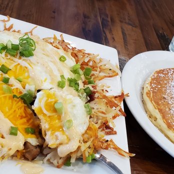 The Pan - Loaded hashbrowns with over-easy eggs and upgraded specialty cinnamon roll pancake. Yum!!! - Pizza Near Me - Gardena, California The Pan - Loaded hashbrowns with over-easy eggs and upgraded specialty cinnamon roll pancake. Yum!!! - Pizza Near Me - Gardena, California