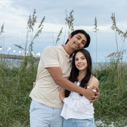 Ocean Isle Beach Photography - Couple photo in the sand dunes with boardwalk and ocean in background