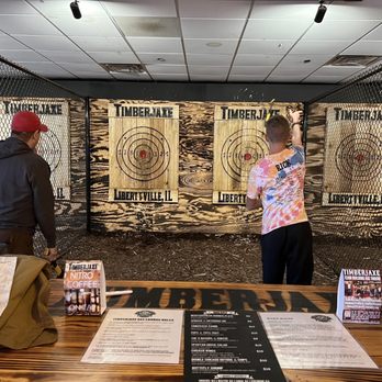 Timberjaxe Axe Throwing Lounge - Throwing and hitting the bullseye - Axe Throwing Near Me - Libertyville, Illinois Timberjaxe Axe Throwing Lounge - Throwing and hitting the bullseye - Axe Throwing Near Me - Libertyville, Illinois