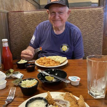 Pirate's Landing - Husband enjoying nice platter of popcorn shrimp. - Seafood Near Me - Elkin, North Carolina