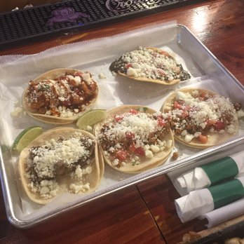 Rebellion Brew Haus - a tray of tacos on a bar - Breweries Near Me - Moline, Illinois Rebellion Brew Haus - a tray of tacos on a bar - Breweries Near Me - Moline, Illinois
