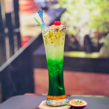 VieTea - a green cocktail with a cherry garnish - Bubble Tea Near Me - Myrtle Beach, South Carolina VieTea - a green cocktail with a cherry garnish - Bubble Tea Near Me - Myrtle Beach, South Carolina