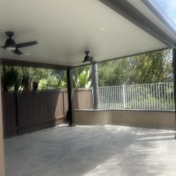 Partial view of the patio overhang and new brick pavers and wall they built. Partial view of the patio overhang and new brick pavers and wall they built.