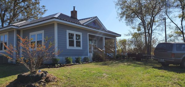 Home Remodel - This home was built around 1930.  The homeowner hired us to make some minor changes inside and open up the common areas.  Some time later, we had completely reframed the entire home, enlarged the guest bedroom, and built the back deck.  Project included full electrical rewire, full plumbing replacement, all new siding, doors and windows.  ln short, this is now a brand new home, the owners became close friends through the project, and will be considered family from now on.