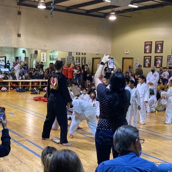 SA Kids Karate - White belt breaking their first board with a hammer fist - Karate Near Me - San Antonio, Texas