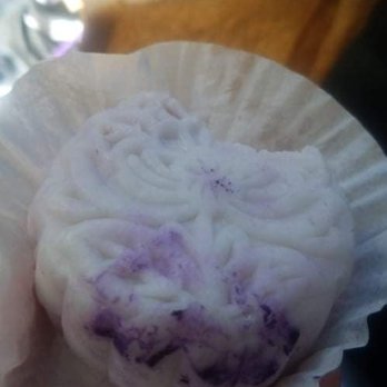 Tí Cafe - Taro snowskin mooncake with an impulsive bite taken out - Coffee & Tea Near Me - Denver, Colorado Tí Cafe - Taro snowskin mooncake with an impulsive bite taken out - Coffee & Tea Near Me - Denver, Colorado