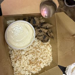 a few bites of kafta. rice. nothing else under the rice. hummus a few bites of kafta. rice. nothing else under the rice. hummus