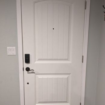 Jaime Handyman - a white door with a black handle - Plumbing Near Me