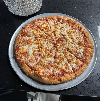 Photo of P J's Sports Bar - Moreno Valley, CA, US. a pizza on a pan