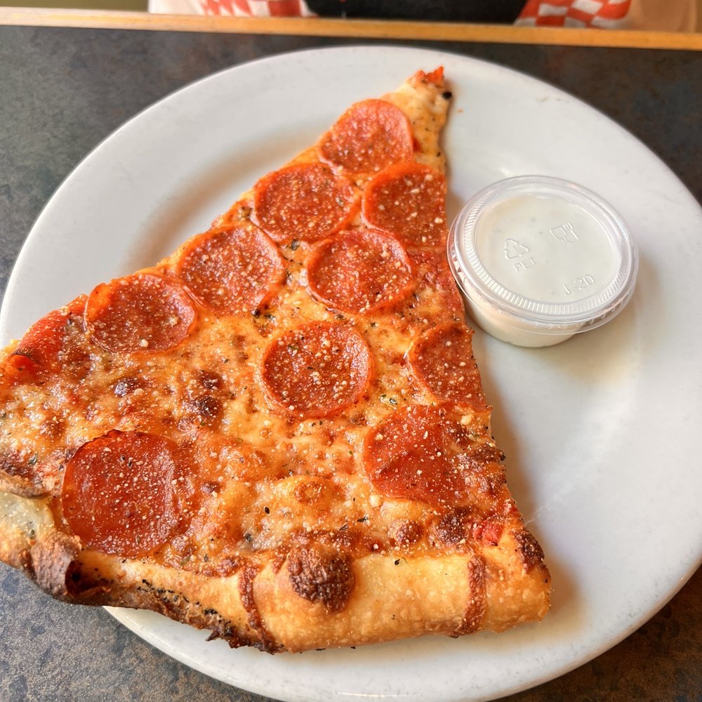 Mezza Luna Pizzeria - Pepperoni slice - Pizza Near Me - Eugene, Oregon