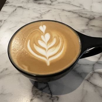 Seventh Square Coffee - latte art in a black mug - Coffee & Tea Near Me - West Monroe, Louisiana Seventh Square Coffee - latte art in a black mug - Coffee & Tea Near Me - West Monroe, Louisiana