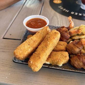 The Spot - Mozzarella cheese sticks on the sampler platter - Burgers Near Me - Galveston, Texas The Spot - Mozzarella cheese sticks on the sampler platter - Burgers Near Me - Galveston, Texas