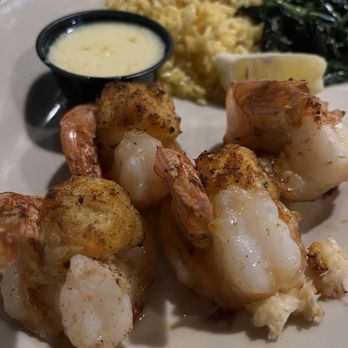 Mr Big Fish - 4 Shrimp Oscar with sauteed spinach & saffron rice. It came with a butter sauce. - Seafood Near Me - Naples, Florida Mr Big Fish - 4 Shrimp Oscar with sauteed spinach & saffron rice. It came with a butter sauce. - Seafood Near Me - Naples, Florida