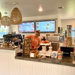 This is the counter at The Travel Mug. The barista is the owner's sister, with her daughter chatting up customers near the register.