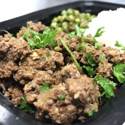Mighty Mealz Meal Prep Delivery Service - Picadillo lean ground beef with sautéed peas and white rice.