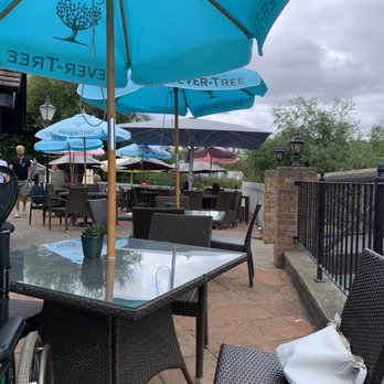 Coy Carp - Outside sitting area right by the water. - Pubs Near Me - Harefield, XGL Coy Carp - Outside sitting area right by the water. - Pubs Near Me - Harefield, XGL