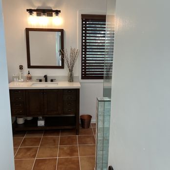 One Hat Construction - New tile floor, vanity, oil rubbed bronze fixtures, Bryan chose the craftsman light! - General Contractors Near Me - San Diego, California