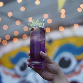 Thay Bar Thai Food - a hand holding a purple drink - Thai Near Me - Toronto, Ontario Thay Bar Thai Food - a hand holding a purple drink - Thai Near Me - Toronto, Ontario