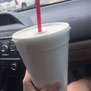 Oasis Daiquiris - a person holding a drink in their hand - Beer, Wine & Spirits Near Me - Monroe, Louisiana Oasis Daiquiris - a person holding a drink in their hand - Beer, Wine & Spirits Near Me - Monroe, Louisiana