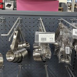 Chefs' Toys - Stainless steel measuring cups, ~15.99, and spoons, $3.99. 6/2025