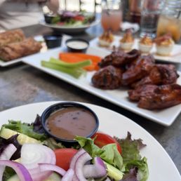 Small house Salad and smoked buffalo wings.