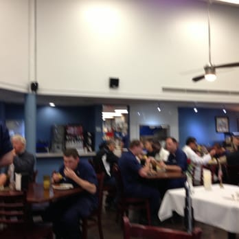 USCG Galley - a group of people sitting at tables in a restaurant - New American Near Me - San Francisco, California USCG Galley - a group of people sitting at tables in a restaurant - New American Near Me - San Francisco, California