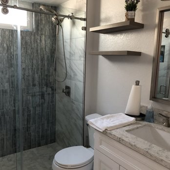 The Cabinet Lady - Increased the size of the shower by pushing the wall back. Updated the vanity as well. Looks incredible! - General Contractors Near Me