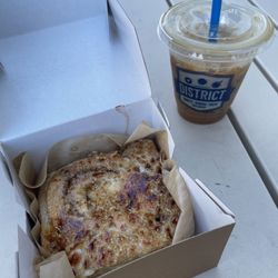 District - Cinnamon Bun ($4.75) & Vietnamese Iced Coffee - 12oz ($4.60)