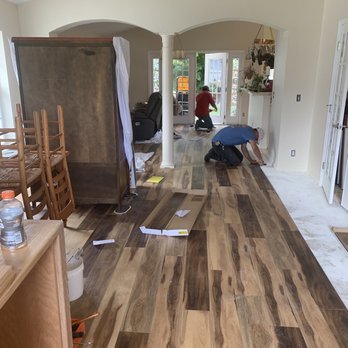 Jupiter Granite - Men at work with installation; social distancing in practice. - Kitchen & Bath Near Me - Jupiter, Florida
