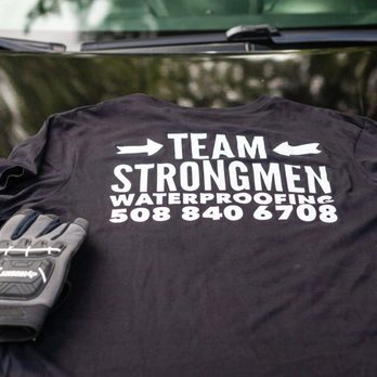 Strongmen Waterproofing - a t - shirt and gloves - Waterproofing Near Me