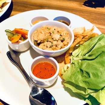 Yard House - Chicken Lettuce Wraps. So good! Comes with three different sauces - New American Near Me - Troy, Michigan Yard House - Chicken Lettuce Wraps. So good! Comes with three different sauces - New American Near Me - Troy, Michigan