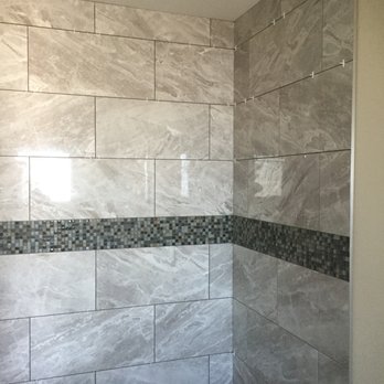 YMSN Flooring - a bathroom with a tiled shower - Flooring Near Me YMSN Flooring - a bathroom with a tiled shower - Flooring Near Me