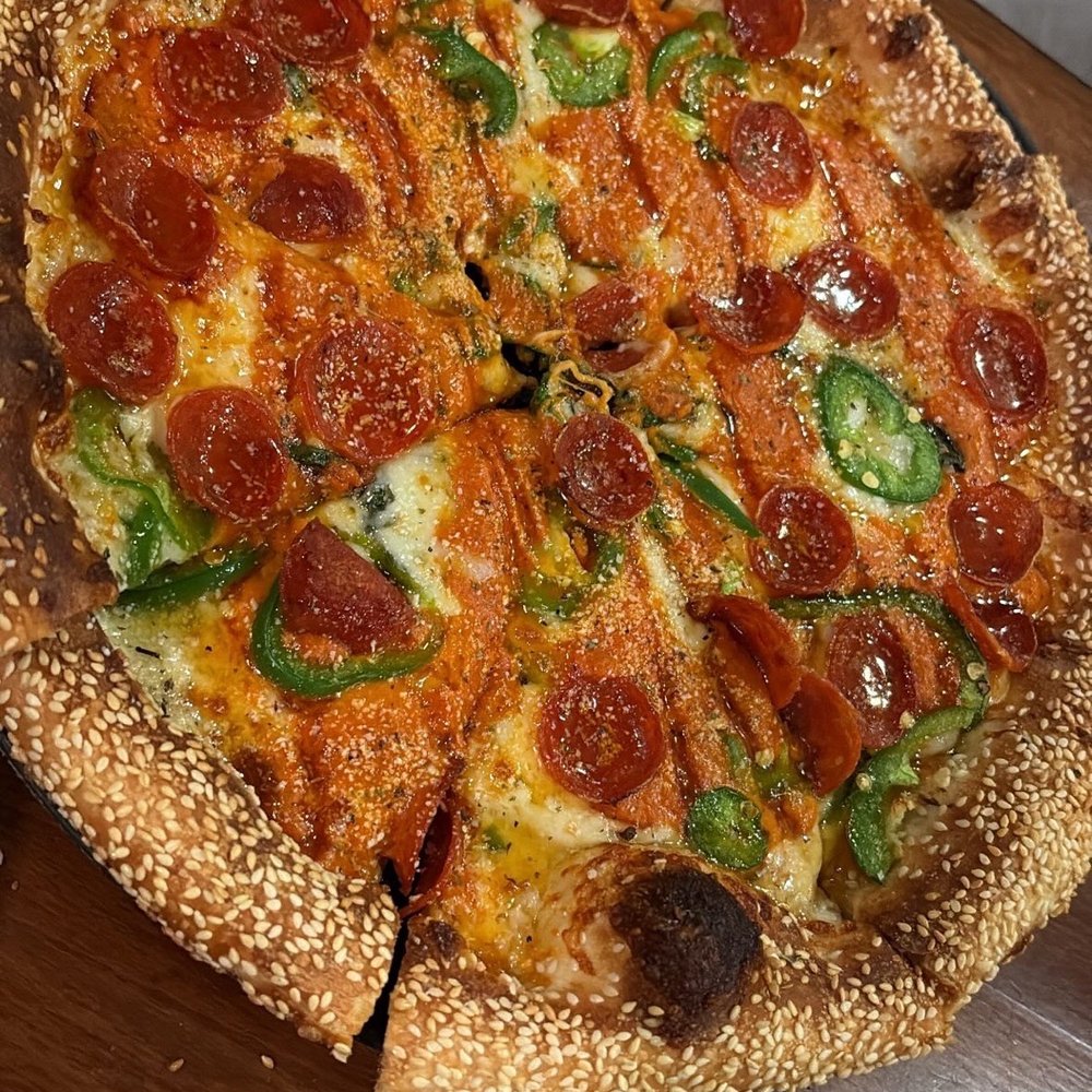 Rebellion Pizza - Spicy honey pepperoni with jalapeño and sesame crust - Pizza Near Me - Henderson, Nevada Rebellion Pizza - Spicy honey pepperoni with jalapeño and sesame crust - Pizza Near Me - Henderson, Nevada