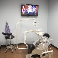 Friendly Dental of Rivergate - Friendly Dental of Rivergate Dentist office chair and television