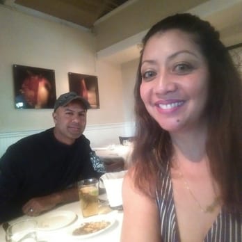 Piatti Danville - Having a chardonnay and hubbs is having a corona. Im having spicy prawn chiattta and hubbs is having the pork chop dish. - Italian Near Me - Danville, California
