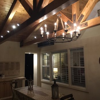 Davi Construction & Development - a dining room with a chandelier - General Contractors Near Me - Monterey, California