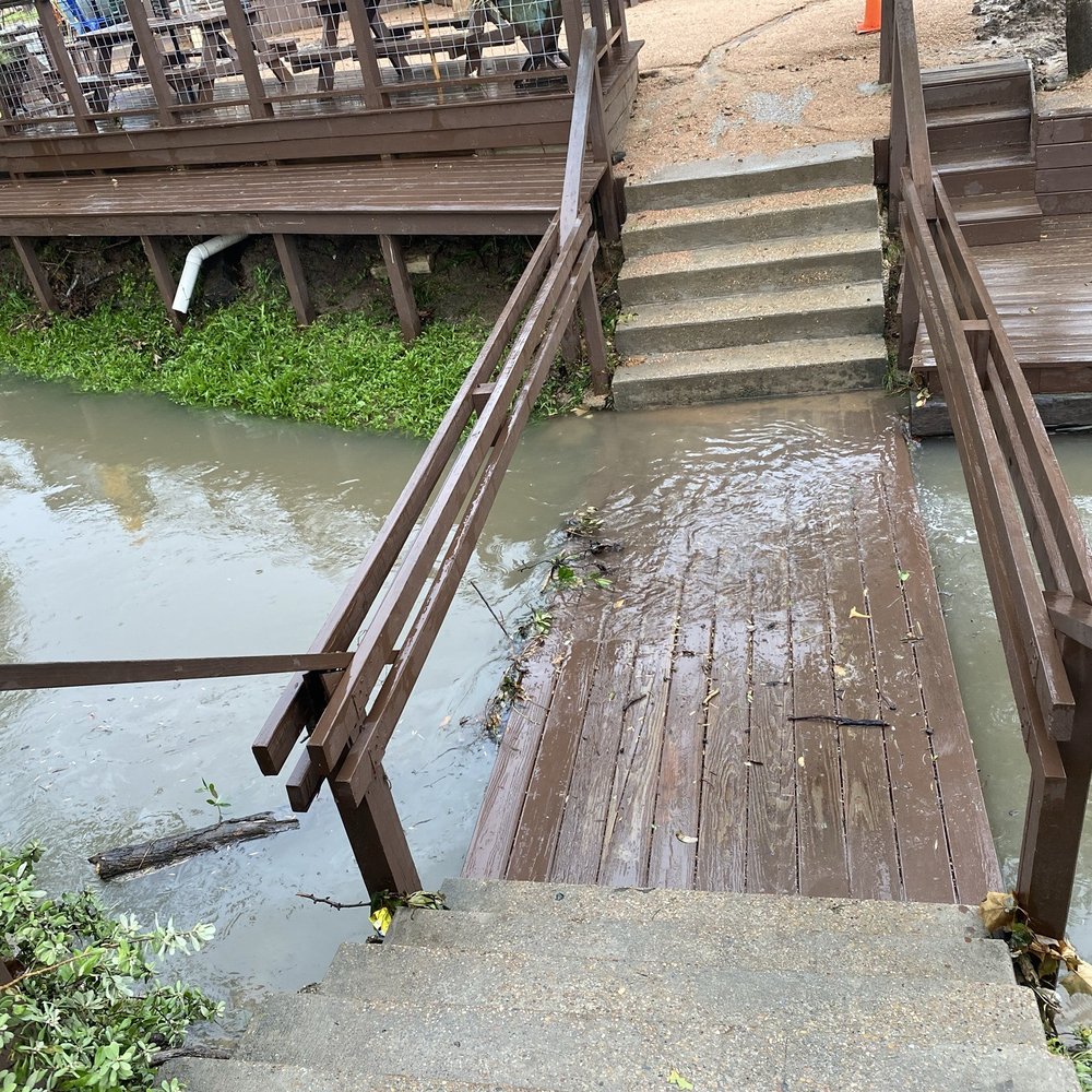 Cedar Creek - Creek rising over the bridge to the parking lot - Bars Near Me - Houston, Texas Cedar Creek - Creek rising over the bridge to the parking lot - Bars Near Me - Houston, Texas