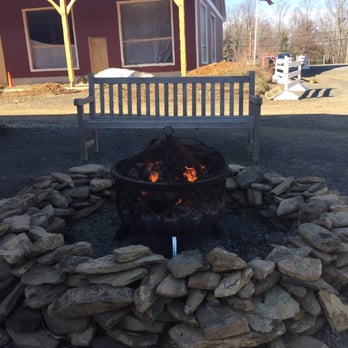 Terhune Orchards - Fire pit outside the tasting room and one if the three benches where you can take your glass and enjoy it - Fruits & Veggies Near Me - Princeton, New Jersey