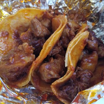 Cesar's Tacos - Dallas - Al pastor steaming hot after unwrapping the foil. - Mexican Near Me - Dallas, Texas