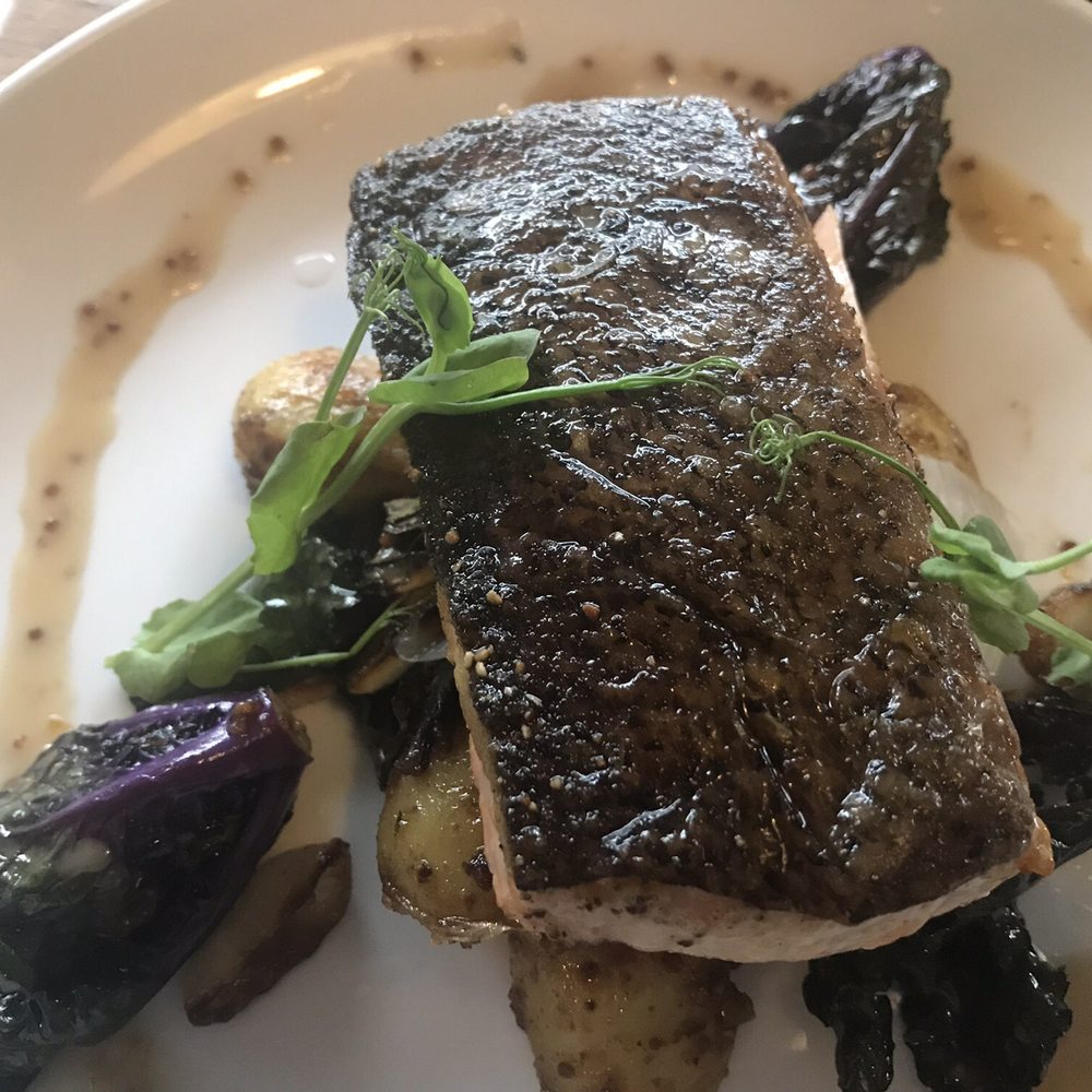 Crush XI - Crispy skin salmon on fingerling potatoes. Perfectly cooked moist and flaky, and more generous than the other entrees. - New American Near Me - Melbourne, Florida