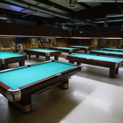 Cue & Cushion - Eight Brunswick professional quality 9 ft. tables covered in super fast Simonis billiard fabric.