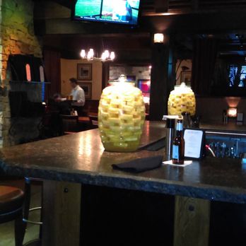 Redstone American Grill - Jars filled with the restaurant's signature pineapple-infused vodka. - Steakhouses Near Me - Maple Grove, Minnesota Redstone American Grill - Jars filled with the restaurant's signature pineapple-infused vodka. - Steakhouses Near Me - Maple Grove, Minnesota