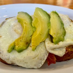 Teskey's General Store & Grill - Open faced breakfast sandwich. There's bacon & cheddar below the fried eggs and avocado.