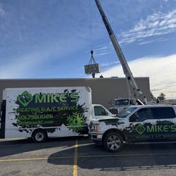 Mike's Heating & A/C Service - Installing rooftop package unit at Acadiana Cinemas in Picayune