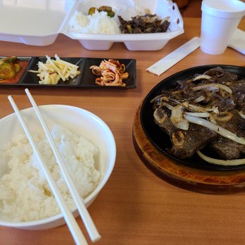 Dosirak Korean Cafe - This is the galbi I usually order! It's delicious short ribs that she cuts table side; it comes with the sides and rice! - Korean Near Me - Conroe, Texas Dosirak Korean Cafe - This is the galbi I usually order! It's delicious short ribs that she cuts table side; it comes with the sides and rice! - Korean Near Me - Conroe, Texas
