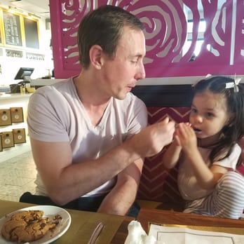 Barking Mad Cafe - Being fed our super chocolaty chocolate chip cookie - Coffee & Tea Near Me - Gaithersburg, Maryland