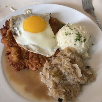 Gasthaus Tirol - Schnitzel Holstein (veal) w/ whipped potatoes and sauerkraut - German Near Me - Cumming, Georgia
